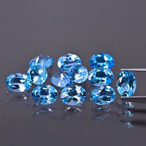 Piatră ovală, con - topaz Swiss Blue 7x5 MM